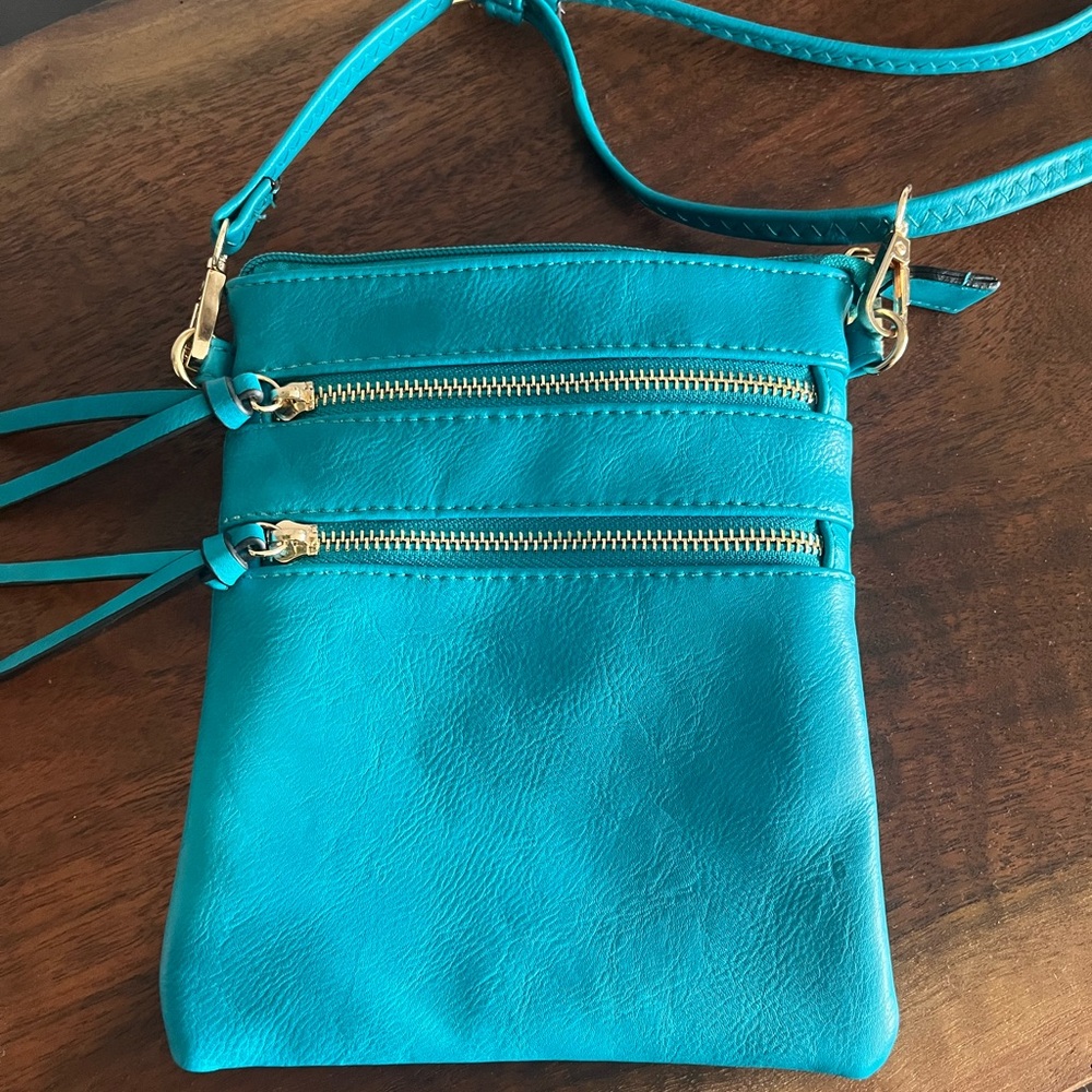 Vibrant Blue Crossbody Bag with Gold Hardware